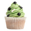 Cupcake with green frosting and soccer themed decorations on a white background