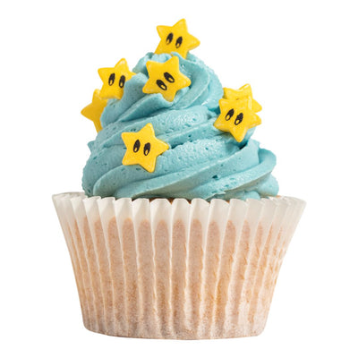 Cupcake with blue frosting and yellow star-shaped decorations on a white background