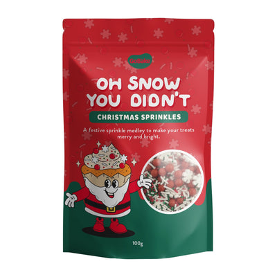 Red and green package of Christmas sprinkles with a cartoon Santa Claus character on a white background.
