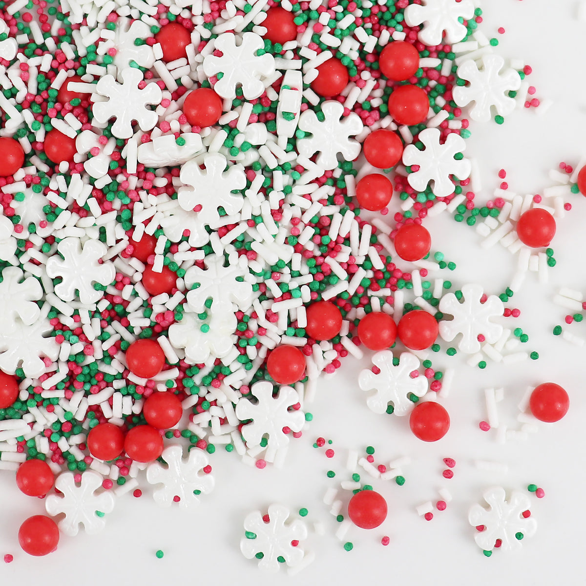 Colorful Christmas-themed sprinkles with red, green, and white on a white background