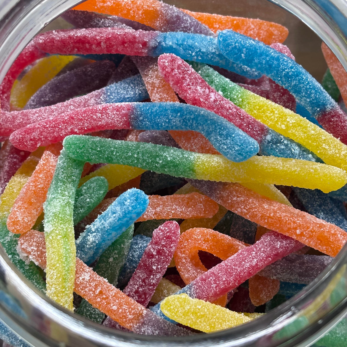 Sour glow worm lollies