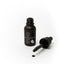 Black bottle of Sprinks gel color with dropper on a white background