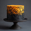 A cylindrical cake with a black and orange gradient design, decorated with a black branch-like pattern, displayed on a dark pedestal stand against a dark gray background.