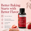 A bottle of Lorann Better Than Extracts Strawberry Baking Flavor Emulsion is shown on a soft pink background with promotional text and a slice of strawberry cake and a whole strawberry. The bottle is dark amber with a black cap and a red label.