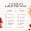 An infographic comparison graphic titled 'WHY LORANN BAKERY EMULSIONS' on a light cream background, showing a comparison table between LorAnn Bakery Emulsions and Traditional Extracts, with decorative strawberries and a cookie on the sides.