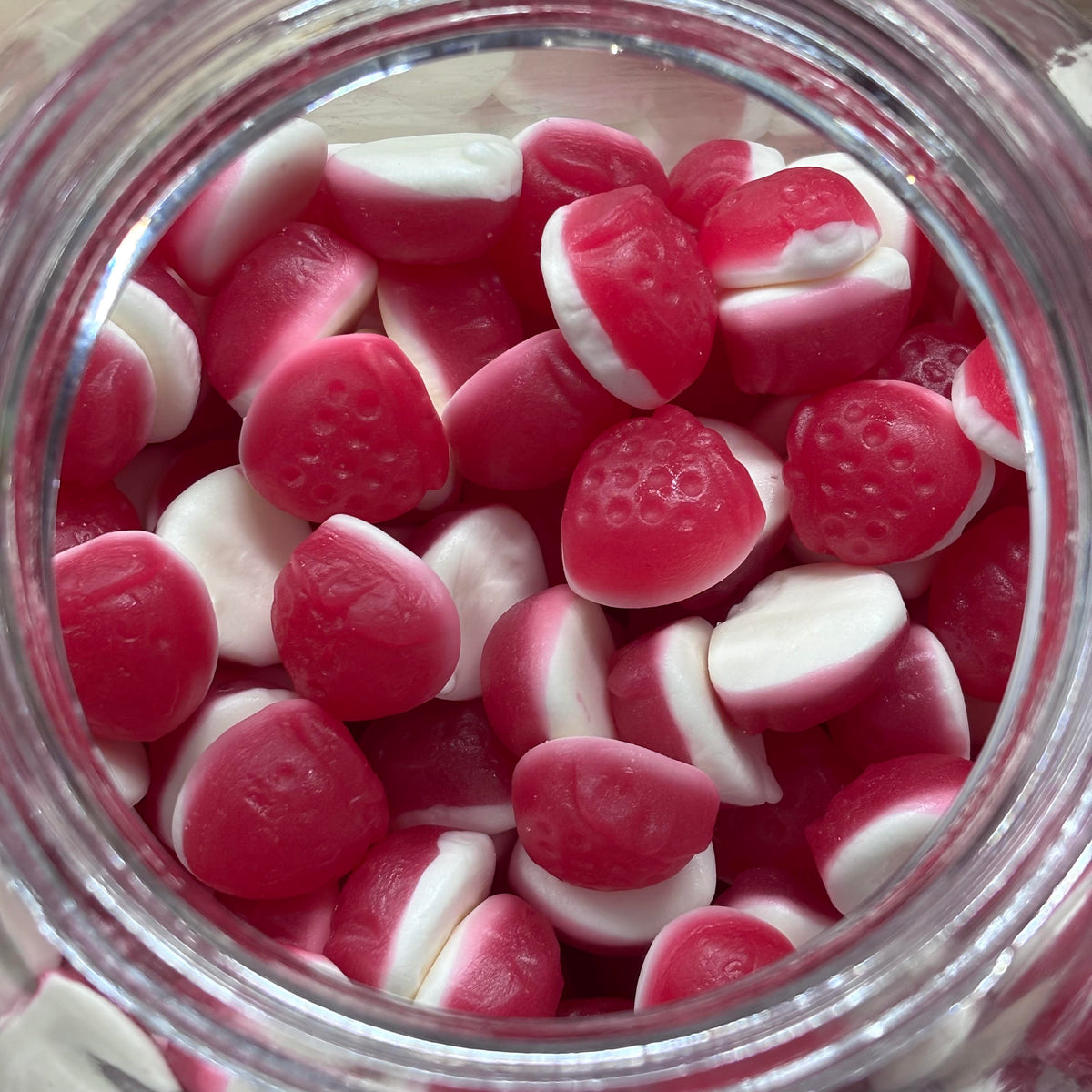 Strawberries and cream gummy candy lollies