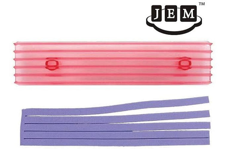 A JEM strip cutter featuring a translucent pink corrugated cutter and purple fondant strips, shown on a plain white background with the JEM logo in the top right corner.