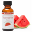 Bottle of LorAnn Oils watermelon flavor with sliced watermelon on a white background