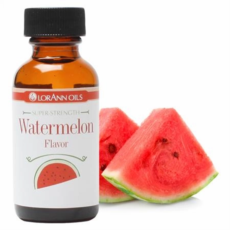 Bottle of LorAnn Oils watermelon flavor with sliced watermelon on a white background