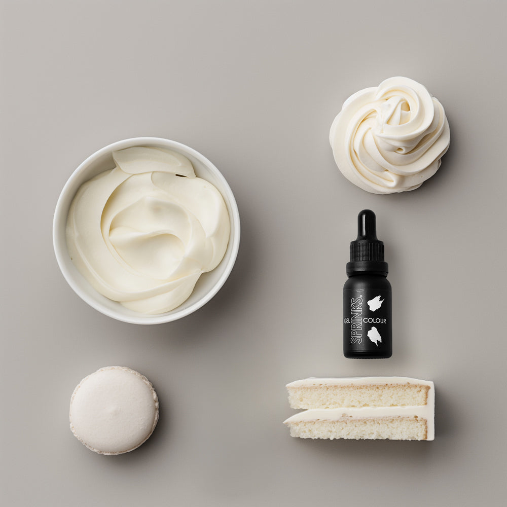 White icing examples and a bottle of sprinks white food colouring