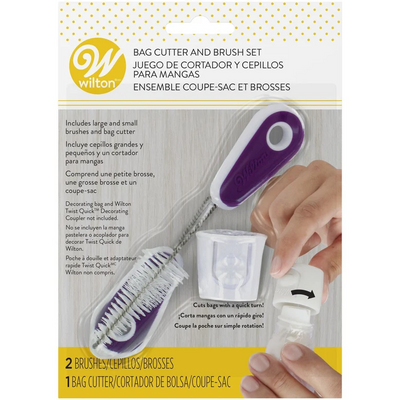 Wilton bag cutter and brush set in retail packaging, showing the purple and white bag cutter being used with two brushes and accessories. The package includes English and Spanish text and a Wilton logo.