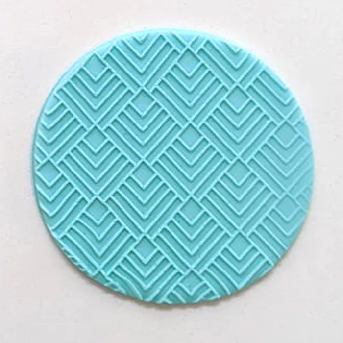 A blue fondant icing example with chevron pattern