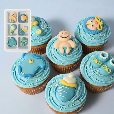 Decorative cupcakes with blue frosting and baby-themed decorations