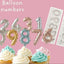 Balloon numbers (made from Edible Modelling paste and painted with edible paint) in various colors with their corresponding silicone mould on a pink background.