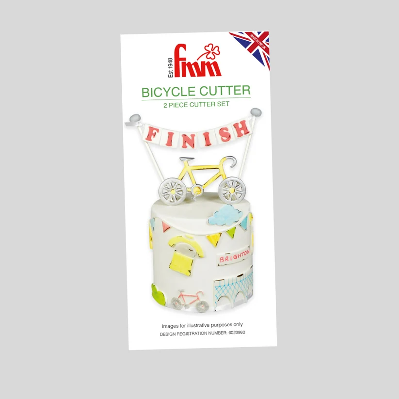 A  cake topper cutter set labeled 'Bicycle Cutter 2 Piece Cutter Set' on a light gray background. The package shows a white cake decorated with colorful cycling-themed graphics and a yellow bicycle topper with a 'FINISH' banner.