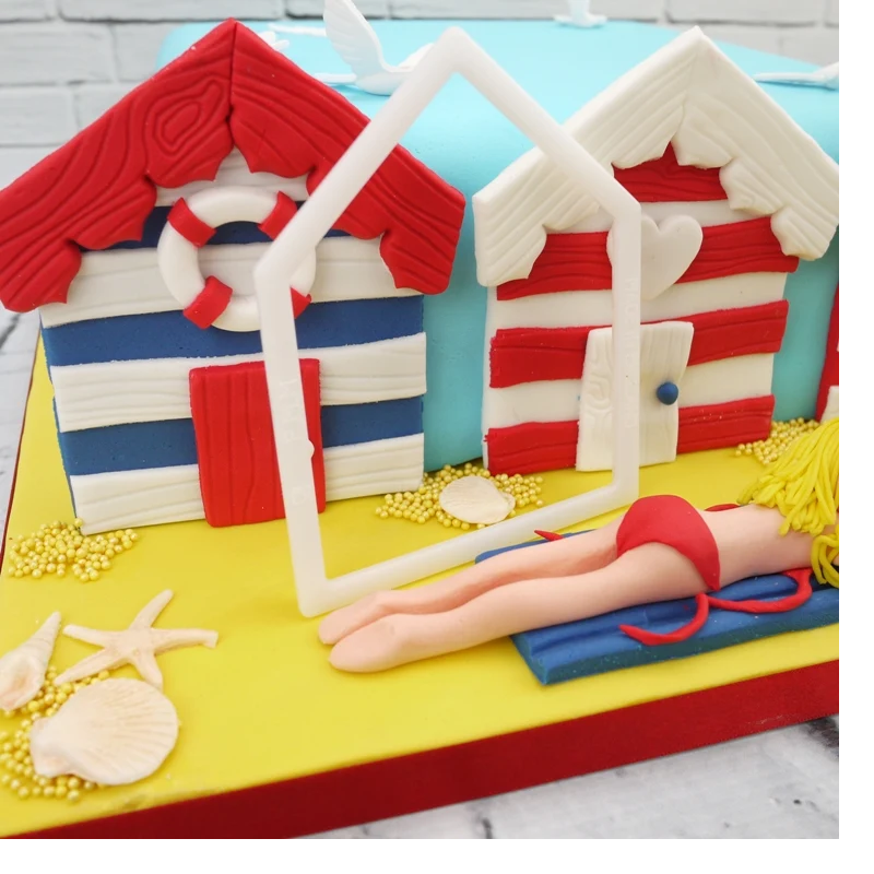 fondant icing beach huts on a cake