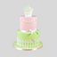 a cake with a small birdhouse on top