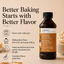 A bottle of Lorann Better Than Extracts Brown Butter baking emulsion shown on a warm beige background with promotional text and baking-themed icons. The bottle is dark amber with a black cap and an orange label.
