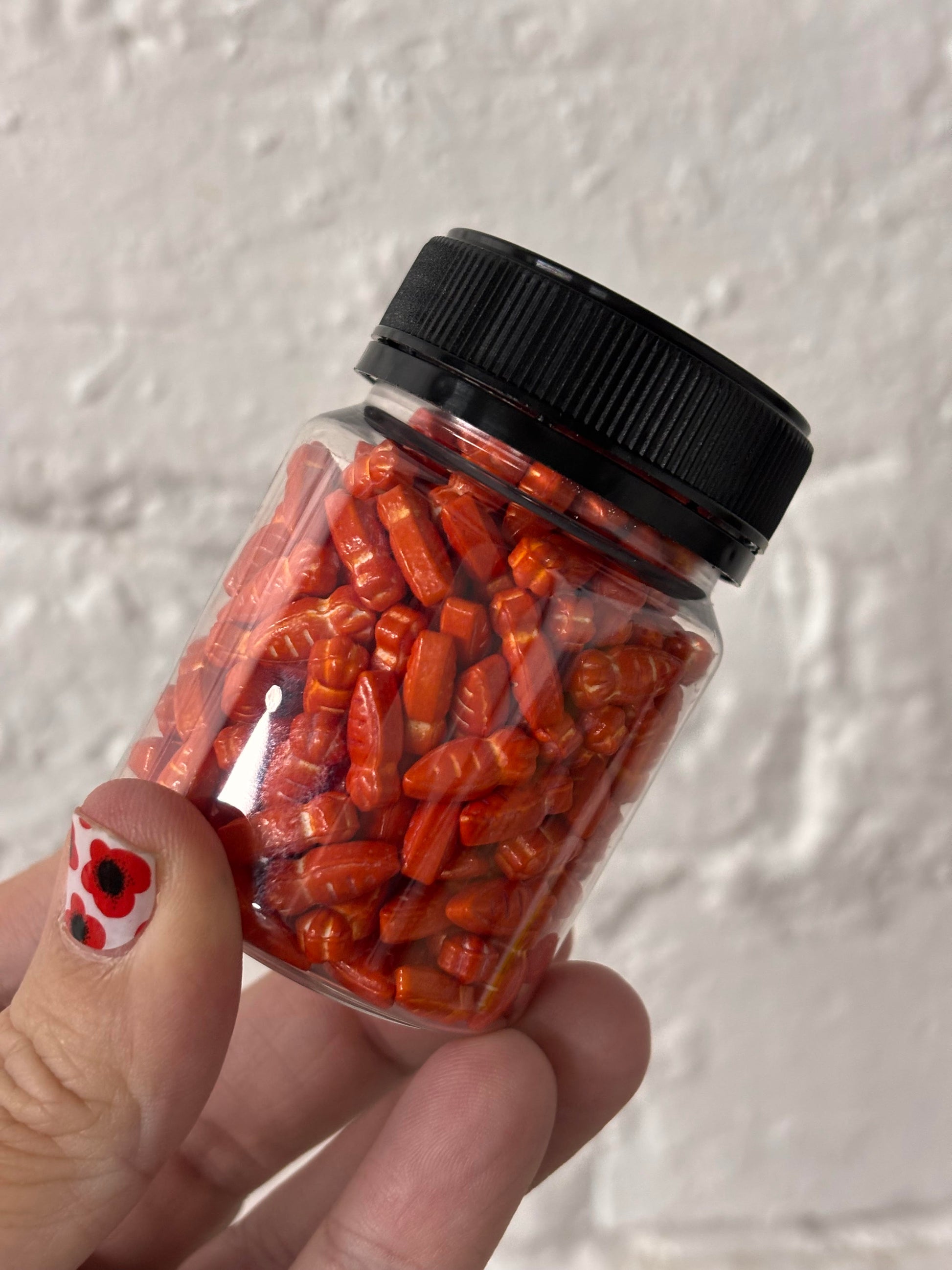 Jar of 14mm carrot shaped sprinkles