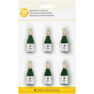 Packaging of champagne bottle-shaped birthday candles with 'Wilton' branding.