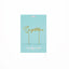 Gold 'Congratulations' cake topper set on a light blue card with 'Cake & Candle' branding.