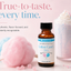 A bottle of LorAnn Oils cotton candy flavor essential oil centered in a styled product photo with pink and blue cotton candy, a pink milkshake, and promotional text on a soft pink background.