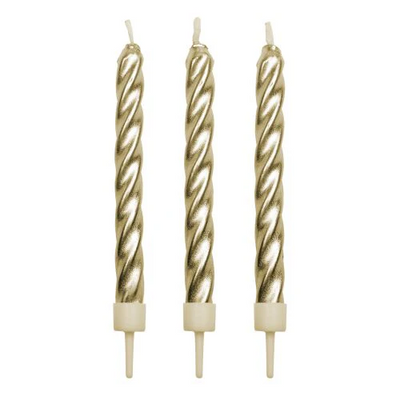 gold candles with white candle holders for birthday cakes