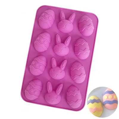 Pink silicone mold with Easter designs on a white background