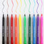 Ten dual-tip edible ink markers in assorted colors are lined up horizontally on a white background, each showing a wavy line of the corresponding marker color above it.