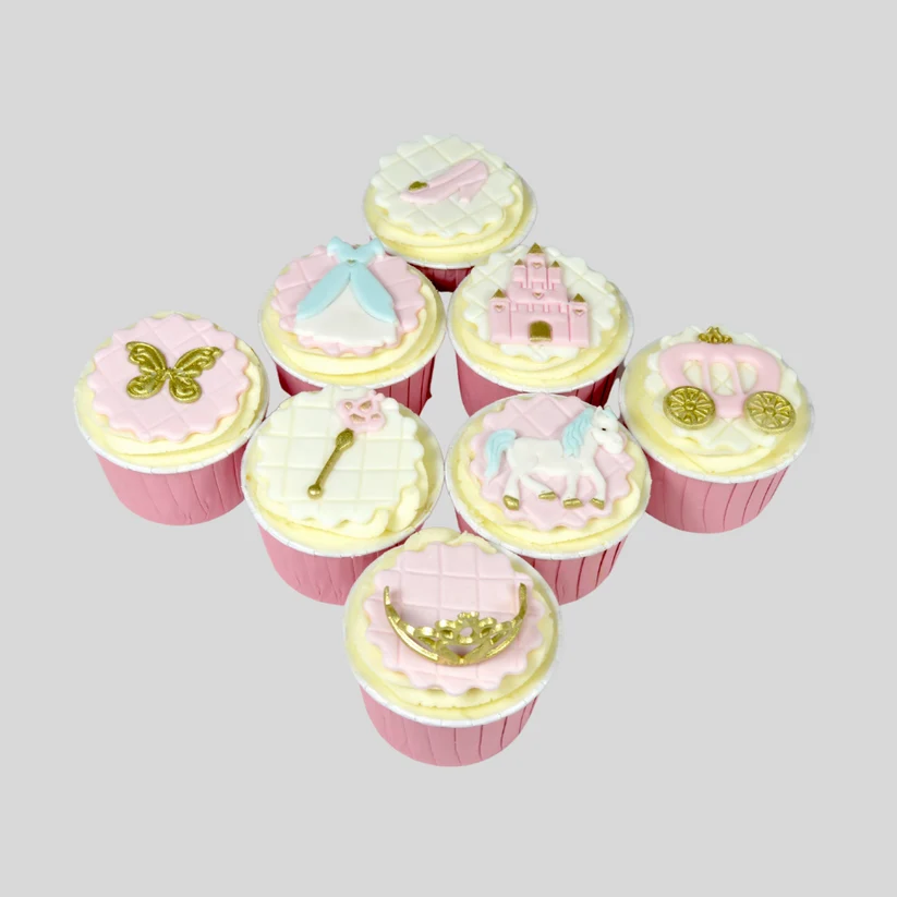 FMM Fairytale motifs cutter set and icing examples on top of cupcakes
