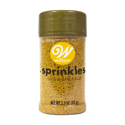 Jar of gold sanding sugar with Wilton logo on a white background