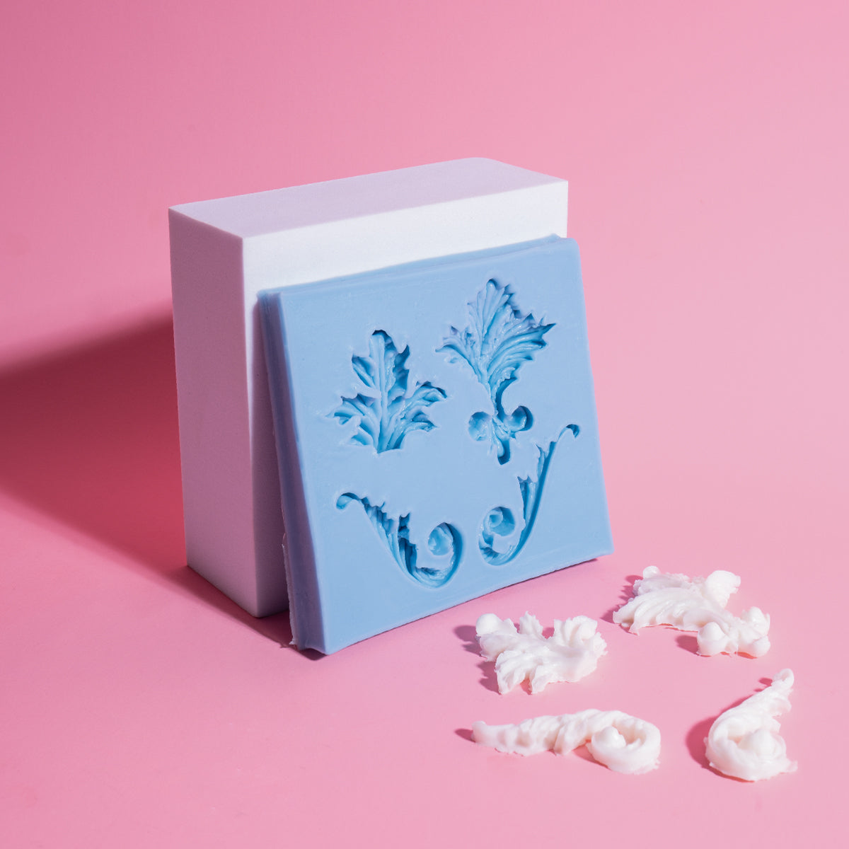 Decorative silicone mold with baroque design on a pink background