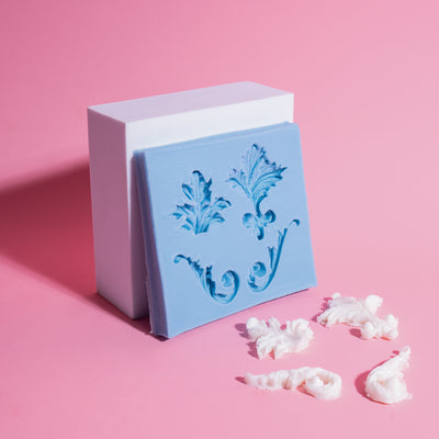 Decorative silicone mold with baroque design on a pink background