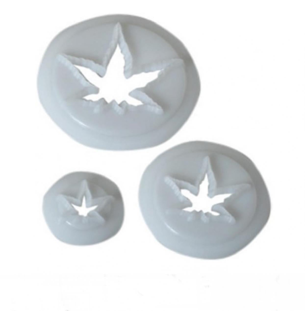 Three round white plastic gumpaste icing cutters in different sizes, each featuring a maple leaf cutout, displayed on a white background.