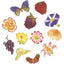 A collection of fondant icing decorations on a white background, including a purple butterfly, a red strawberry, a purple raspberry, a purple and white flower, a yellow-orange flower, a pink-and-white flower, a yellow flower, a yellow-orange rose, a cluster of purple grapes, a pale yellow flower, and two acorns.
