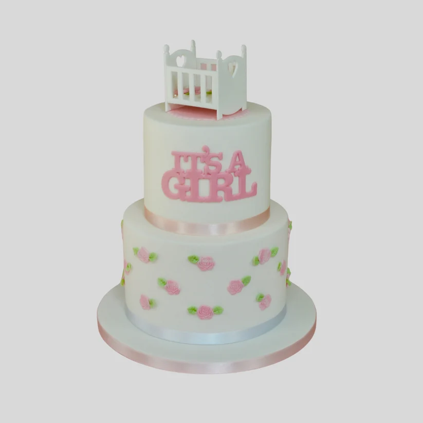 cake with baby cot and it's a girl