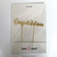 Gold 'Congratulations' cake topper set in Cake Craft packaging on a white background