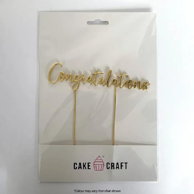 Gold 'Congratulations' cake topper set in Cake Craft packaging on a white background