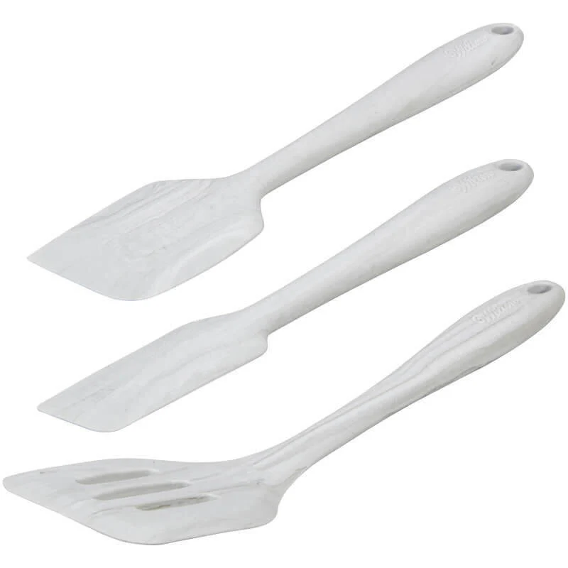 Three white spatulas with different shapes on a white background