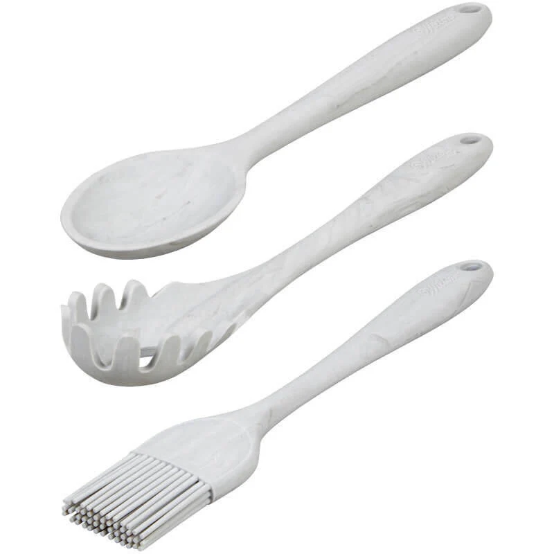 Set of three white kitchen utensils on a white background