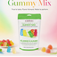 A bag of LorAnn Gummy Mix candy stands on a white surface against a soft pastel gradient background. The package is white with a green top and green text, and colorful gummy bears are printed on the front.