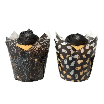 Two cupcakes in Halloween-themed wrappers on a white background
