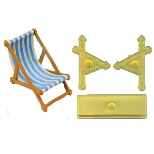 A miniature deck chair set with a blue and white stripe icing fabric light wood frame,  three yellow plastic cutters used to make it, shown on a plain white background.