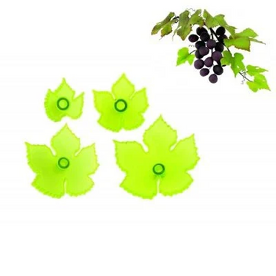 Jem cutters in the shape of grape leaves. With a finished icing example of a bunch of grapes