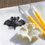 Jem bat cutter mould alongside a fondant example with modelling tools on a white mat