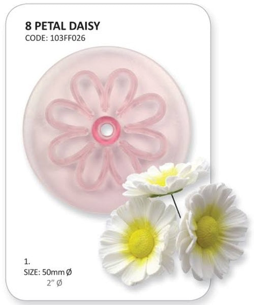 A 50mm pink daisy-shaped cutter for fondant and a real daisy flower shown alongside for scale.
