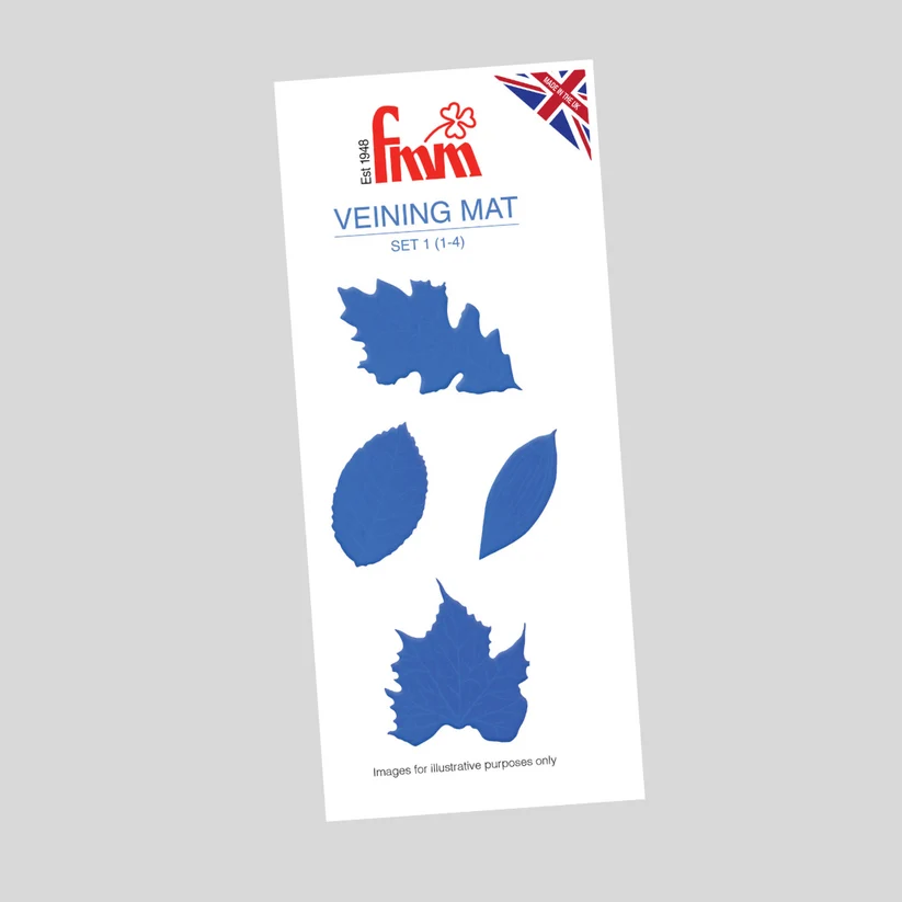 A Fmm brand veining mat set containing four blue leaf-shaped veiners on a white backing card, shown against a solid gray background.