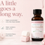 A bottle of LorAnn oils Marshmallow Super Strength flavor displayed on a light pink background with marshmallows and dripping marshmallow graphics. Text on the left highlights key product benefits.