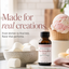 A bottle of Lorann Super-Strength Marshmallow Flavor is displayed on a marble surface with marshmallows, ice cream, and cupcakes in a bright kitchen setting. Text on the left reads 'Made for real creations.