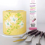 Yellow cake with floral decorations next to Cake Craft palette knives packaging